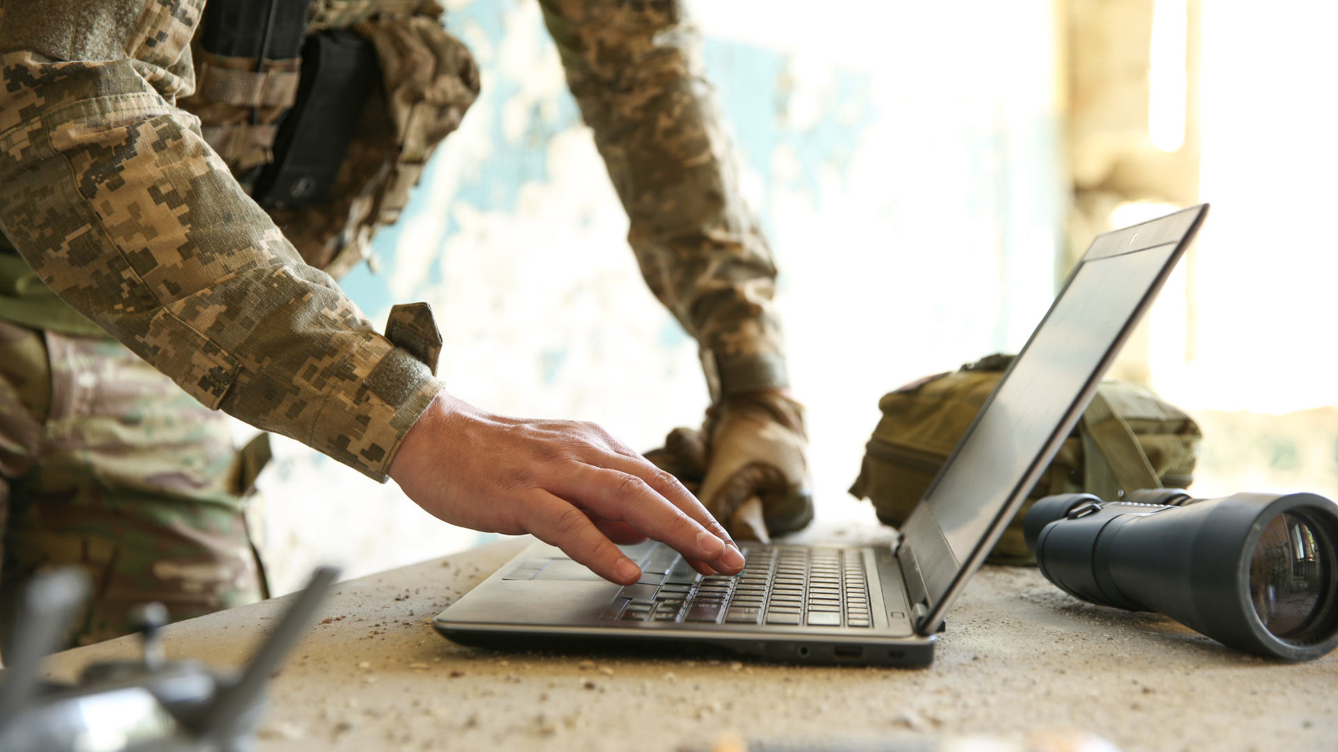 military members using a connected device in the field