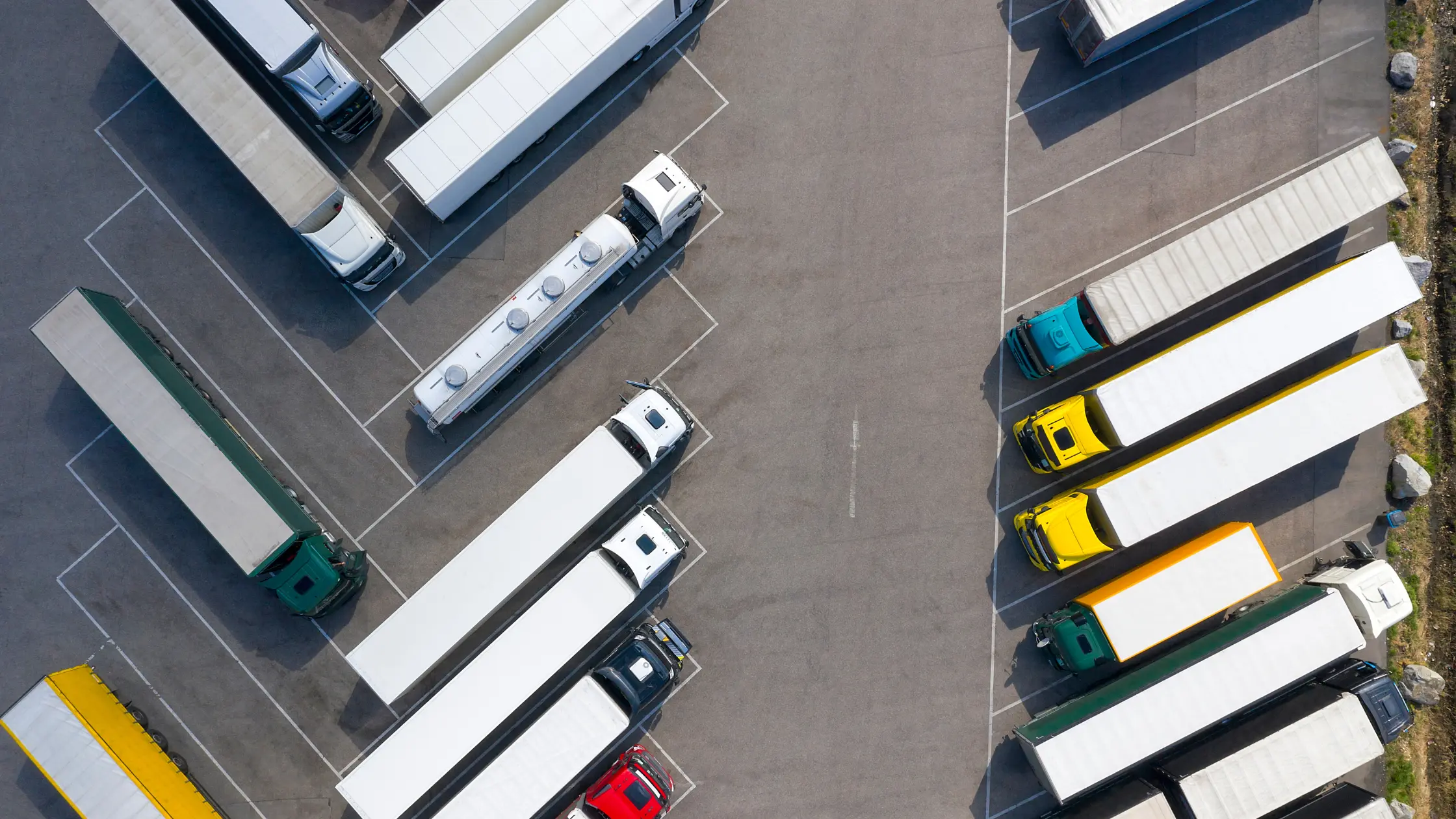 Aerial view of Semitrucks parked in parking lot